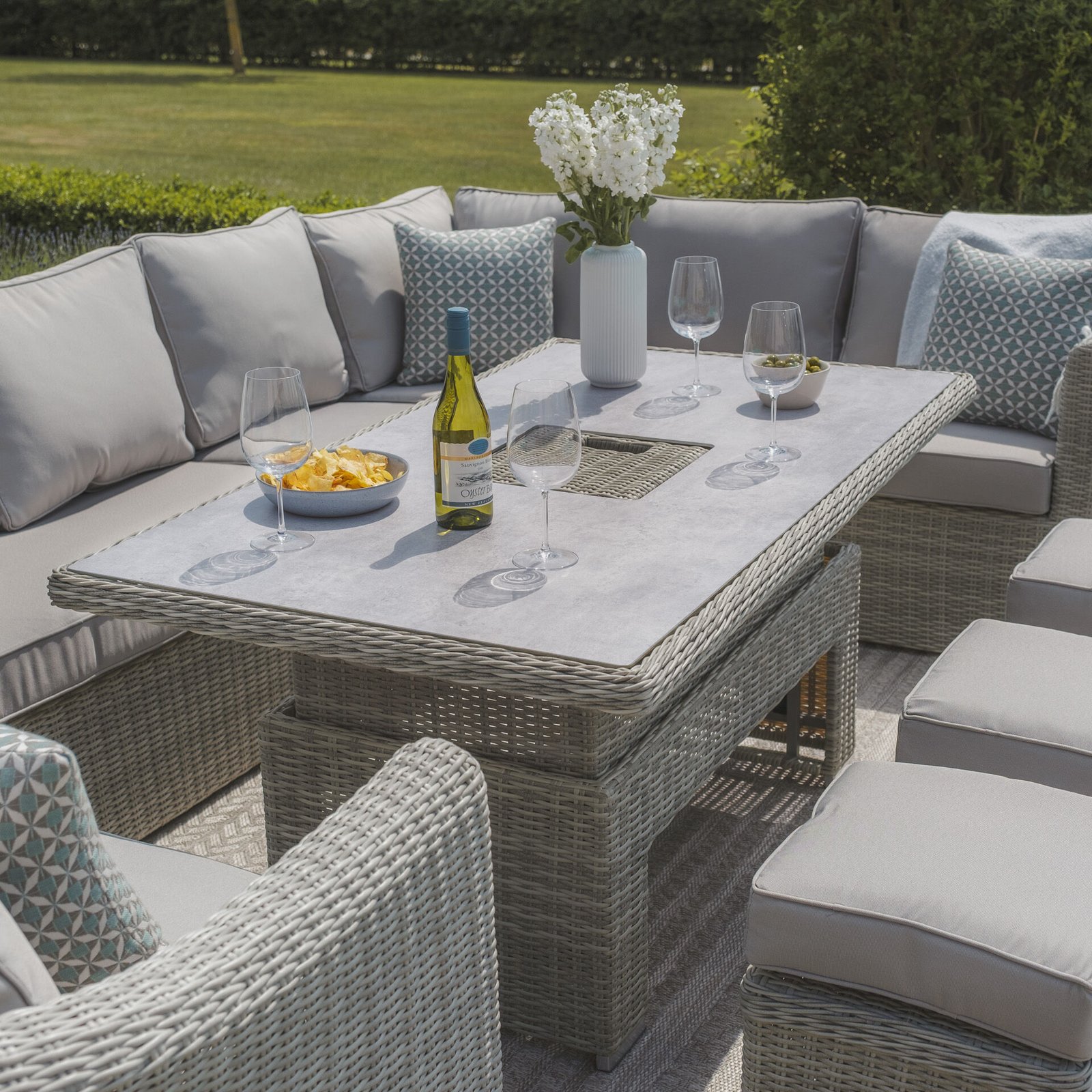A Oxford Deluxe Large Rattan Corner Dining Set with Rising Table & Armchair - Ceramic Glass - Image 3